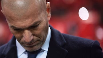 Real Madrid's French head coach Zinedine Zidane looks down before the Spanish league football match Sevilla FC vs Real Madrid CF at the Ramon Sanchez Pizjuan stadium in Sevilla on January 15, 2017