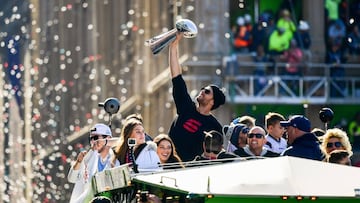 BOSTON, MASSACHUSETTS - FEBRUARY 05: Tom Brady #12 of the New England Patriots reacts as he holds the Vince Lombardi trophy during the Super Bowl Victory Parade on February 05, 2019 in Boston, Massachusetts.   Billie Weiss/Getty Images/AFP
 == FOR NEWSPAPERS, INTERNET, TELCOS &amp; TELEVISION USE ONLY ==