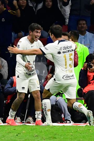 Pumas' Mexican midfielder #15 Ulises Rivas (R) celebrates scoring his team's third goal with Puma's Mexican defender #13 Pablo Monroy during the Mexican Apertura tournament football match between Cruz Azul and Pumas at Azteca stadium in Mexico City on October 7, 2023. (Photo by CLAUDIO CRUZ / AFP)
