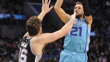 Nov 23, 2016; Charlotte, NC, USA; Charlotte Hornets guard forward Marco Belinelli (21) shoots the ball over San Antonio Spurs center Pau Gasol (16) during the first half of the game at the Spectrum Center. Mandatory Credit: Sam Sharpe-USA TODAY Sports