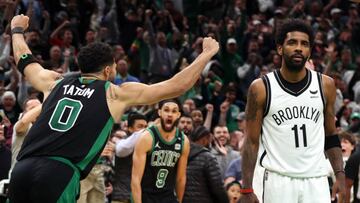 BOSTON, MASSACHUSETTS - APRIL 17: Jayson Tatum #0 of the Boston Celtics celebrates the game winning basket as Kyrie Irving #11 of the Brooklyn Nets looks on during the fourth quarter of Round 1 Game 1 of the 2022 NBA Eastern Conference Playoffs at TD Garden on April 17, 2022 in Boston, Massachusetts. The Celtics defeat the Nets 115-114. (Photo by Maddie Meyer/Getty Images)