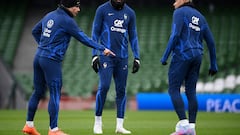 France's striker Antoine Griezmann (L) speaks with France's striker Marcus Thuram (C) and France's striker Kylian Mbappe (R) during a France football team training session at Aviva Stadium in Dublin, Ireland on March 26, 2023, the eve of their Euro 2024 qualifier against Republic of Ireland. (Photo by FRANCK FIFE / AFP)