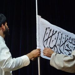 What does the Taliban flag say in English?