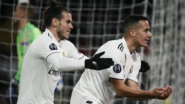 Real Madrid's Spanish midfielder Lucas Vazquez (R) celebrates with Real Madrid's Welsh forward Gareth Bale after scoring 0-2 during the UEFA Champions League group G football match AS Rome vs Real Madrid on November 27, 2018 at the Olympic stadi