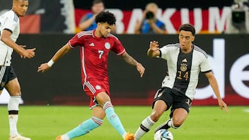 GELSENKIRCHEN, GERMANY - JUNE 20: Luis Diaz of Colombia and Jamal Musiala of Germany battle for the ball during the international friendly match between Germany and Colombia at Veltins-Arena on June 20, 2023 in Gelsenkirchen, Germany. (Photo by Alex Gottschalk/DeFodi Images via Getty Images)