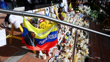 A flag with Colombian colors and an image of Colombian Senator Miguel Uribe Turbay of the opposition Democratic Center party, hangs outside the Santa Fe Foundation hospital, where the senator is being treated after he was shot during a campaign event, in Bogota, Colombia, June 16, 2025. REUTERS/Luisa Gonzalez