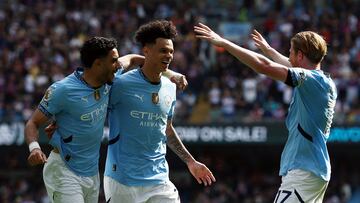 Soccer Football - Premier League - Manchester City v Crystal Palace - Etihad Stadium, Manchester, Britain - April 12, 2025 Manchester City's Nico O'Reilly celebrates scoring their fifth goal with Kevin De Bruyne and Omar Marmoush Action Images via Reuters/Lee Smith EDITORIAL USE ONLY. NO USE WITH UNAUTHORIZED AUDIO, VIDEO, DATA, FIXTURE LISTS, CLUB/LEAGUE LOGOS OR 'LIVE' SERVICES. ONLINE IN-MATCH USE LIMITED TO 120 IMAGES, NO VIDEO EMULATION. NO USE IN BETTING, GAMES OR SINGLE CLUB/LEAGUE/PLAYER PUBLICATIONS. PLEASE CONTACT YOUR ACCOUNT REPRESENTATIVE FOR FURTHER DETAILS..