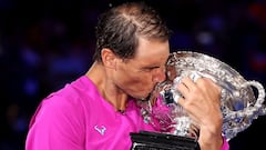 MELBOURNE, AUSTRALIA - JANUARY 30: Rafael Nadal of Spain kisses the Norman Brookes Challenge Cup as he celebrates victory in his Men’s Singles Final match against Daniil Medvedev of Russia during day 14 of the 2022 Australian Open at Melbourne Park on Jan