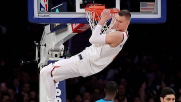 NEW YORK, NY - NOVEMBER 07: Kristaps Porzingis #6 of the New York Knicks hangs on the rim after dunking the ball in the second quarter against the Charlotte Hornets during their game at Madison Square Garden on November 7, 2017 in New York City. NOTE TO USER: User expressly acknowledges and agrees that, by downloading and or using this photograph, User is consenting to the terms and conditions of the Getty Images License Agreement. Abbie Parr/Getty Images/AFP
== FOR NEWSPAPERS, INTERNET, TELCOS & TELEVISION USE ONLY ==