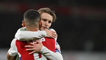 Arsenal's Brazilian striker #09 Gabriel Jesus (front) celebrates with Arsenal's Norwegian midfielder #08 Martin Odegaard after scoring his team third goal during the English League Cup quarter-final football match between Arsenal and Crystal Palace at the Emirates Stadium, in London, on December 18, 2024. (Photo by Glyn KIRK / AFP) / RESTRICTED TO EDITORIAL USE. No use with unauthorized audio, video, data, fixture lists, club/league logos or 'live' services. Online in-match use limited to 120 images. An additional 40 images may be used in extra time. No video emulation. Social media in-match use limited to 120 images. An additional 40 images may be used in extra time. No use in betting publications, games or single club/league/player publications. /