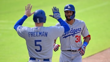 Aug 6, 2023; San Diego, California, USA; Los Angeles Dodgers second baseman Amed Rosario (31) is congratulated by first baseman Freddie Freeman (5) after hitting a two-run home run against San Diego Padres starting pitcher Rich Hill (left) during the first inning at Petco Park. Mandatory Credit: Orlando Ramirez-USA TODAY Sports