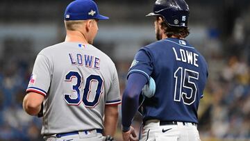 ST PETERSBURG, FLORIDA - OCTOBER 04: Josh Lowe #15 of the Tampa Bay Rays stands on first base next to his brother Nathaniel Lowe #30 of the Texas Rangers