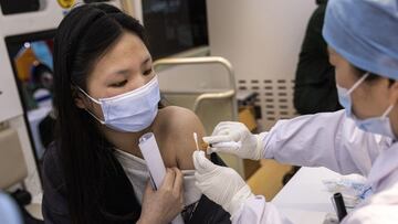 WUHAN, CHINA - APRIL 08: (CHINA OUT) Residents receive the COVID-19 vaccine on the move vaccination vehicle during the 3rd World Health Expo held on April 8, 2021 in Wuhan, Hubei Province, China. Which more than 1,400 exhibitors, including General Electric, Philips and Siemens, attended the expo with an exhibition area spanning 160,000 square meters. The 4-day Second World Health Expo kicked off here on Thursday, with a focus on displaying cutting-edge science and technology in the global health industry. Wuhan implemented a 76 day lockdown from January 23rd to April 8th.2020.because the local government strictly defends the Covid-19 Wuhan With no recorded cases of community transmissions since May 2020, life for residents is gradually returning to normal. (Photo by Getty Images)