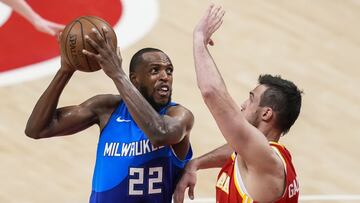 Jun 27, 2021; Atlanta, Georgia, USA; Milwaukee Bucks forward Khris Middleton (22) looks for a shot against Atlanta Hawks forward Danilo Gallinari (8) during the second half during game three of the Eastern Conference Finals for the 2021 NBA Playoffs at State Farm Arena. Mandatory Credit: Dale Zanine-USA TODAY Sports