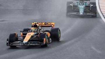 McLaren's British driver Lando Norris (L) and Aston Martin's Canadian driver Lance Stroll drive during the third practice session at The Circuit Zandvoort, ahead of the Dutch Formula One Grand Prix, in Zandvoort on August 26, 2023. (Photo by SIMON WOHLFAHRT / AFP)