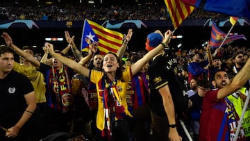 Barcelona fans cheer their team before the UEFA Champions League 1st round, group C, football match between FC Barcelona and Inter Milan at the Camp Nou stadium in Barcelona on October 12, 2022. (Photo by Pau BARRENA / AFP)