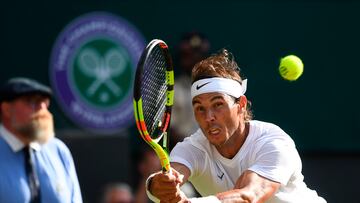 Rafael Nadal returns against Roger Federer during the men's singles semi-finals at Wimbledon in 2019.