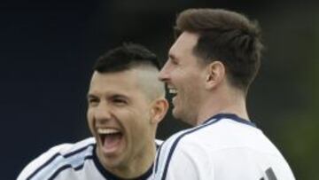 Argentina's Lionel Messi, right, and Sergio Aguero take part in a training session in Buenos Aires, Argentina, Monday, March 21, 2016. Argentina will face Chile on a World Cup qualifying soccer match in Santiago, Chile on March 24. (AP Photo/Natacha Pisarenko)