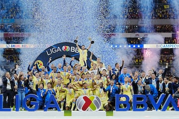    Henry Martin lifts the Clausura 2024 champion and Champion of Champions trophies  during the final second leg match between America and Cruz Azul as part of the Torneo Clausura 2024 Liga BBVA MX at Azteca Stadium on May 26, 2024 in Mexico City, Mexico.