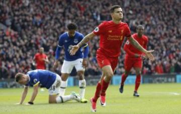 Britain Soccer Football - Liverpool v Everton - Premier League - Anfield - 1/4/17 Liverpool's Philippe Coutinho celebrates scoring their second goal as Everton's Matthew Pennington (L) looks dejected