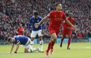 Britain Soccer Football - Liverpool v Everton - Premier League - Anfield - 1/4/17 Liverpool's Philippe Coutinho celebrates scoring their second goal as Everton's Matthew Pennington (L) looks dejected 