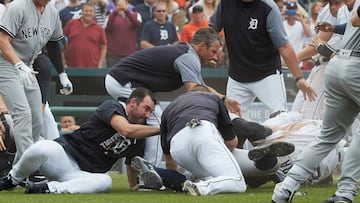 Aug 24, 2017; Detroit, MI, USA; Detroit Tigers manager Brad Ausmus (center) and starting pitcher Justin Verlander (left) try to get players off Detroit Tigers first baseman Miguel Cabrera (bottom right) after benches clear during the sixth inning of the game against the New York Yankees at Comerica Park. Mandatory Credit: Rick Osentoski-USA TODAY Sports     TPX IMAGES OF THE DAY