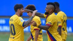 Barcelona&#039;s Argentine forward Lionel Messi (L) celebrates his second goal with Barcelona&#039;s Chilean midfielder Arturo Vidal during the Spanish league football match between Deportivo Alaves and FC Barcelona at the Mendizorroza stadium in Vitoria 