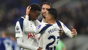Tottenham Hotspur's Senegalese forward #29 Pape Matar Sarr (L) celebrates with Tottenham Hotspur's Uruguayan midfielder #30 Rodrigo Bentancur (C) and Tottenham Hotspur's Spanish defender #23 Pedro Porro (R) after scoring their third goal during the English Premier League football match between Everton and Tottenham Hotspur at Hill Dickinson Stadium in Liverpool, north west England on October 26, 2025. (Photo by PETER POWELL / AFP) / RESTRICTED TO EDITORIAL USE. No use with unauthorized audio, video, data, fixture lists, club/league logos or 'live' services. Online in-match use limited to 120 images. An additional 40 images may be used in extra time. No video emulation. Social media in-match use limited to 120 images. An additional 40 images may be used in extra time. No use in betting publications, games or single club/league/player publications. /