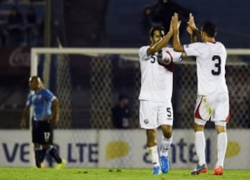 Costa Rica\x92s Celso Borges, center, and Giancarlo Gonzalez celebrates after his team scored during a friendly soccer match in Montevideo, Uruguay, Thursday, Nov. 13, 2014. (AP Photo/Matilde Campodonico)