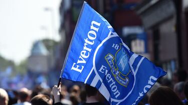 (FILES) Everton supporters wave the club's flag before the start of the English Premier League football match between Everton and Bournemouth at Goodison Park in Liverpool, north west England on May 28, 2023. Everton have been docked 10 points after being found guilty of breaching Premier League financial rules, plunging one of England's most storied football clubs into the relegation zone. The punishment, the biggest sporting sanction in the history of the competition, leaves Sean Dyche's side 19th in the table on a total of just four points after 12 matches -- five points from safety. (Photo by PETER POWELL / AFP) / RESTRICTED TO EDITORIAL USE. No use with unauthorized audio, video, data, fixture lists, club/league logos or 'live' services. Online in-match use limited to 120 images. An additional 40 images may be used in extra time. No video emulation. Social media in-match use limited to 120 images. An additional 40 images may be used in extra time. No use in betting publications, games or single club/league/player publications. /