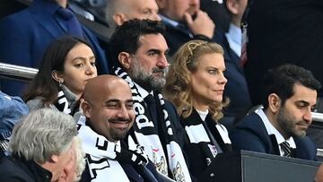 Newcastle United's Saudi Arabian chairman Yasir Al-Rumayyan (C) and Newcastle United's English minority owner Amanda Staveley (centre right) watch from their seats late on in the English Premier League football match between Newcastle United and