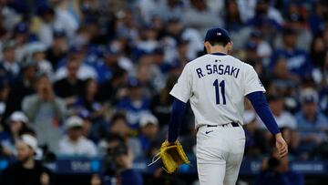 LOS ANGELES, CALIFORNIA - MARCH 29: Roki Sasaki #11 of the Los Angeles Dodgers leaves the game during the second inning against the Detroit Tigers at Dodger Stadium on March 29, 2025 in Los Angeles, California. Harry How/Getty Images/AFP (Photo by Harry How / GETTY IMAGES NORTH AMERICA / Getty Images via AFP)
