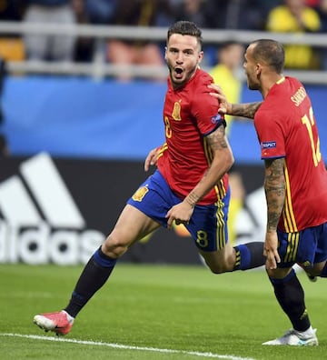 Spain's midfielder Saul Niguez celebrates scoring the opening goal with his teammate Sandro Ramirez against FYR Macedonia.