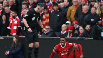 Liverpool's Dutch midfielder #38 Ryan Gravenberch (R) reacts during the English League Cup final football match between Chelsea and Liverpool at Wembley stadium, in London, on February 25, 2024. (Photo by Adrian DENNIS / AFP) / RESTRICTED TO EDITORIAL USE. No use with unauthorized audio, video, data, fixture lists, club/league logos or 'live' services. Online in-match use limited to 120 images. An additional 40 images may be used in extra time. No video emulation. Social media in-match use limited to 120 images. An additional 40 images may be used in extra time. No use in betting publications, games or single club/league/player publications. / 