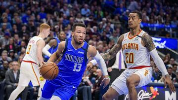 Feb 1, 2020; Dallas, Texas, USA; Dallas Mavericks guard Jalen Brunson (13) drives to the basket past Atlanta Hawks forward John Collins (20) during the second quarter at the American Airlines Center. Mandatory Credit: Jerome Miron-USA TODAY Sports