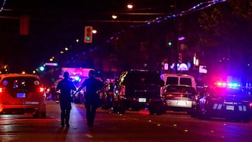 Police officers walk on Fraser street, near the site of the Lapu Lapu day block party where a vehicle drove into a crowd killing several people in Vancouver, British Columbia, Canada April 26, 2025. REUTERS/Jennifer Gauthier