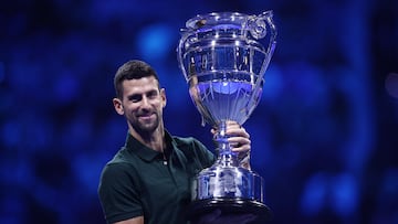 Tennis - ATP Finals - Pala Alpitour, Turin, Italy - November 13, 2023 Serbia's Novak Djokovic poses as he celebrates with the trophy for his 2023 world number one ranking REUTERS/Guglielmo Mangiapane