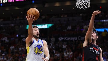 Golden State Warriors guard Klay Thompson (11) drives to the basket against Miami Heat guard Jaime Jaquez Jr. (11) during the first quarter at Kaseya Center.