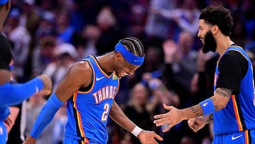 OKLAHOMA CITY, OKLAHOMA - DECEMBER 22: Shai Gilgeous-Alexander #2 and Kenrich Williams #34 of the Oklahoma City Thunder celebrate during during the second half against the Memphis Grizzlies at Paycom Center on December 22, 2025 in Oklahoma City, Oklahoma. NOTE TO USER: User expressly acknowledges and agrees that, by downloading and or using this photograph, User is consenting to the terms and conditions of the Getty Images License Agreement. Joshua Gateley/Getty Images/AFP (Photo by Joshua Gateley / GETTY IMAGES NORTH AMERICA / Getty Images via AFP)