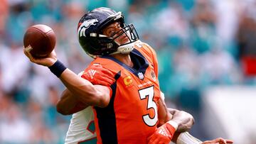 MIAMI GARDENS, FLORIDA - SEPTEMBER 24: Justin Bethel #20 of the Miami Dolphins sacks Russell Wilson #3 of the Denver Broncos during the third quarter at Hard Rock Stadium on September 24, 2023 in Miami Gardens, Florida. Megan Briggs/Getty Images/AFP (Photo by Megan Briggs / GETTY IMAGES NORTH AMERICA / Getty Images via AFP)