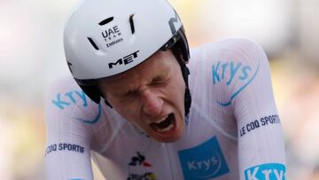 Team UAE Emirates rider Slovenia&#039;s Tadej Pogacar wearing the best young&#039;s white jersey crosses the finish line at the end of the 20th stage of the 107th edition of the Tour de France cycling race, a time trial of 36 km between Lure and La Planch