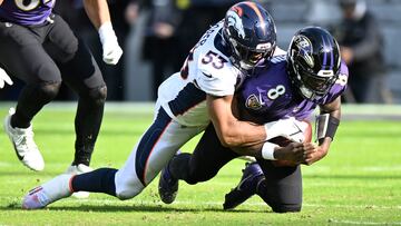 BALTIMORE, MARYLAND - DECEMBER 04: Jonathon Cooper #53 of the Denver Broncos sacks Lamar Jackson #8 of the Baltimore Ravens in the first half of a game at M&T Bank Stadium on December 04, 2022 in Baltimore, Maryland.   Greg Fiume/Getty Images/AFP (Photo by Greg Fiume / GETTY IMAGES NORTH AMERICA / Getty Images via AFP)