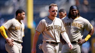 KANSAS CITY, MO - AUGUST 28: San Diego Padres second baseman Brandon Drury (17), first baseman Josh Bell (24) and right fielder Juan Soto (22) react during an MLB game against the Kansas City Royals on August 28, 2022 at Kauffman Stadium in Kansas City, Missouri. (Photo by Joe Robbins/Icon Sportswire via Getty Images)