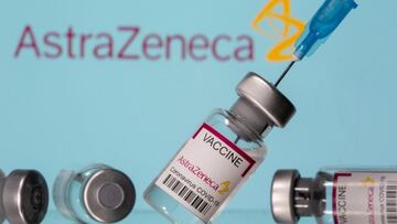 FILE PHOTO: Vials labelled &quot;Astra Zeneca COVID-19 Coronavirus Vaccine&quot; and a syringe are seen in front of a displayed AstraZeneca logo, in this illustration photo taken March 14, 2021. REUTERS/Dado Ruvic/Illustration/File Photo