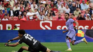 Real Madrid's Brazilian forward Rodrygo (R) vies with Sevilla's Moroccan goalkeeper Yassine Bounou "Bono" during the Spanish league football match between Sevilla FC and Real Madrid CF at the Ramon Sanchez Pizjuan stadium in Seville on May 27, 2023. (Photo by CRISTINA QUICLER / AFP)