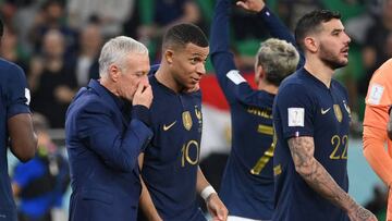 France's forward #10 Kylian Mbappe (C) celebrates with France's coach #00 Didier Deschamps after they won the Qatar 2022 World Cup round of 16 football match between France and Poland at the Al-Thumama Stadium in Doha on December 4, 2022. (Photo by FRANCK FIFE / AFP) (Photo by FRANCK FIFE/AFP via Getty Images)