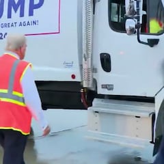Donald Trump close to a fall before climbing into garbage truck to face reporters