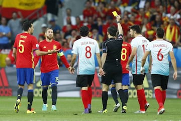 Sergio Ramos shown an early yellow by referee Milorad Mazic