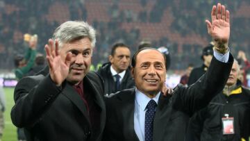 AC Milan coach Carlo Ancelotti (L) and club President Silvio Berlusconi celebrate after winning the "Trofeo Berlusconi" against Juventus at the San Siro stadium in Milan January 6, 2007. REUTERS/Daniele Buffa (ITALY)