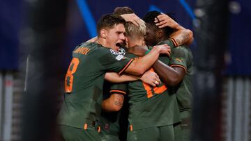 Shakhtar Donetsk's Burkinabe forward Lassina Traore (R) celebrates scoring the 1-4 goal with his team-mates during the UEFA Champions League Group F football match RB Leipzig v FC Shakhtar Donetsk in Leipzig, eastern Germany, on September 6, 2022. (Photo by Odd ANDERSEN / AFP)